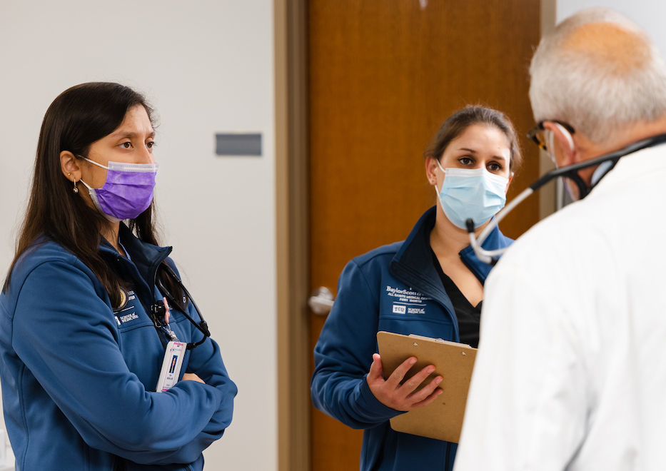 physicians discussing patient care in office